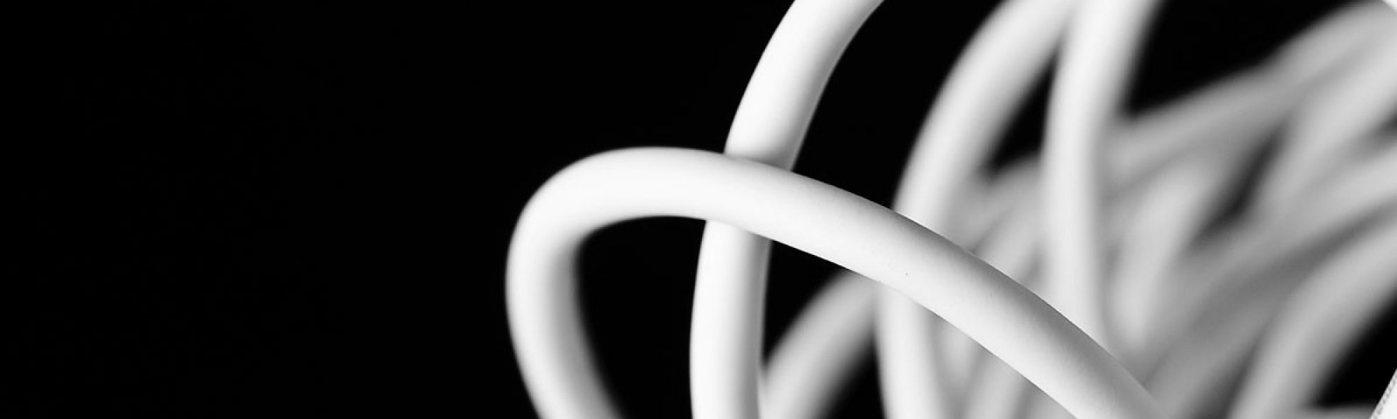 white cables against a black background