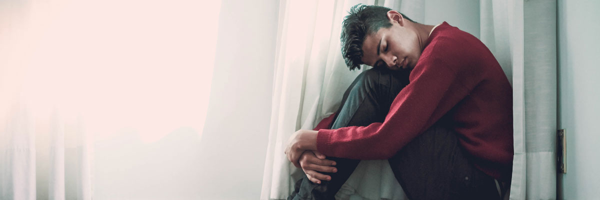 upset man sitting on floor