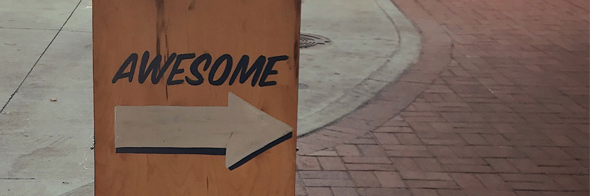 sidewalk sign saying "awesome"